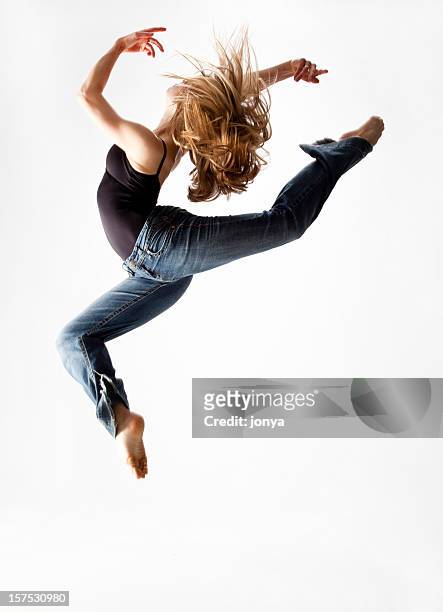 dancer jumping in the air - modern dancing stock pictures, royalty-free photos & images