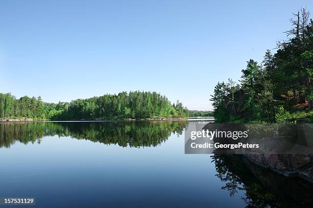 serene lake on perfect summer morning - minnesota lake stock pictures, royalty-free photos & images