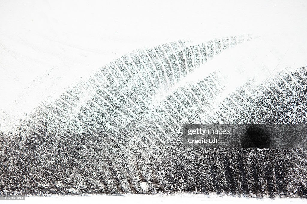 Bycicle tyre tread on a white surface