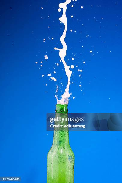 beer bottle - beer splashing stock pictures, royalty-free photos & images