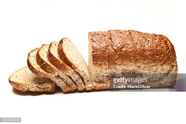 sliced loaf of seeded brown bread - sliced bread stock pictures, royalty-free photos & images