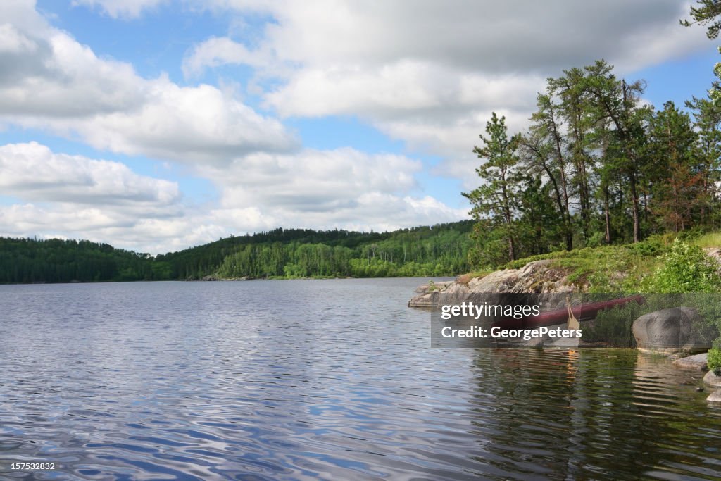 Canoe Resting on Wilderness Lake