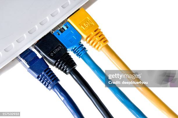 connected! cable pluggeg in lan router on white - wire binding stock pictures, royalty-free photos & images