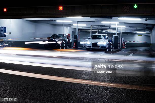 parking garage's exit - blurred motion - exit sign stock pictures, royalty-free photos & images