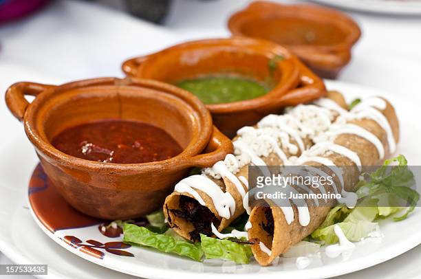 mexican taquitos (flutes) - home made tacos stock pictures, royalty-free photos & images