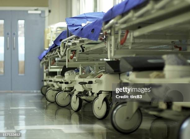 hospital corridor with gurneys - medical ward stock pictures, royalty-free photos & images