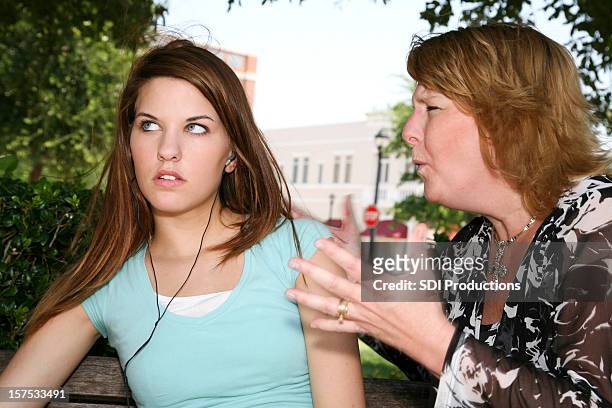 mother lecturing daughter who is ignoring her - rollen met de ogen stockfoto's en -beelden
