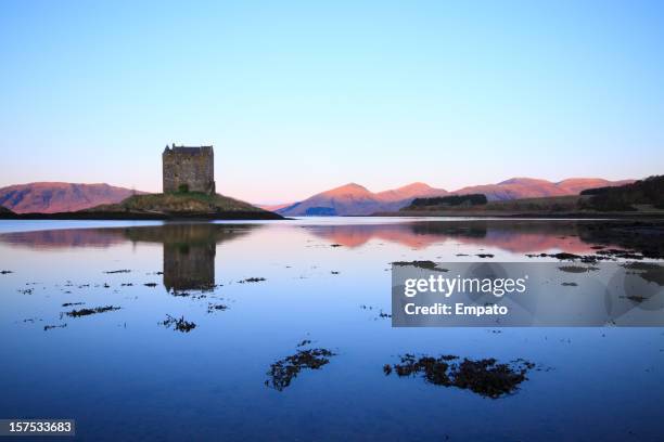 castle stalker, loch linnhe, scotland. idyllic still morning. - fort william stock pictures, royalty-free photos & images