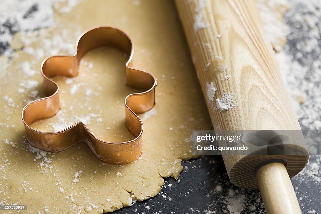 Baking Sugar Cookies with Gingerbread Man Cookie Cutter in Dough