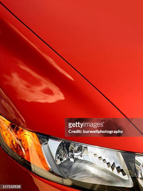 red car front fender with light, close-up - car hood stock pictures, royalty-free photos & images