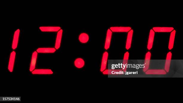 digital reading of 12:00 on a clock - day 12 stockfoto's en -beelden