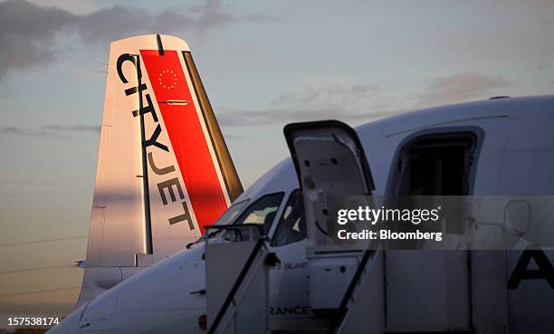 The tailfin of a CityJet Ltd. Aircraft is seen on the tarmac at City Airport in London, U.K., on Tuesday, Dec. 4, 2012. Air France-KLM Group's...