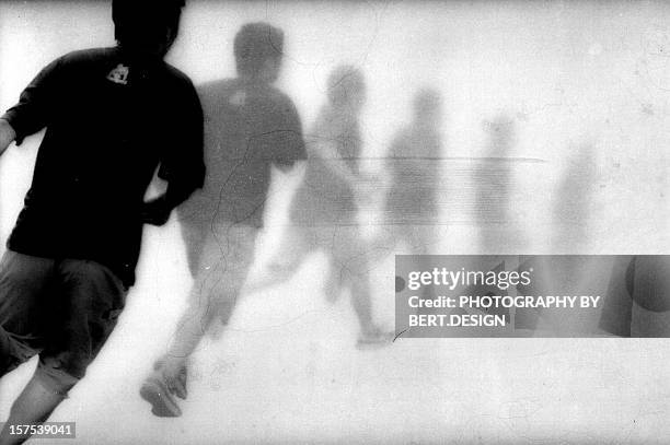 running man - double exposure running stock-fotos und bilder