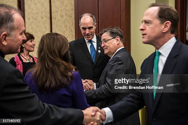 Sen. Robert Casey and U.S. Sen. Pat Toomey greet guests at an event on Capitol Hill to raise awareness of the unfinished national memorial to the...