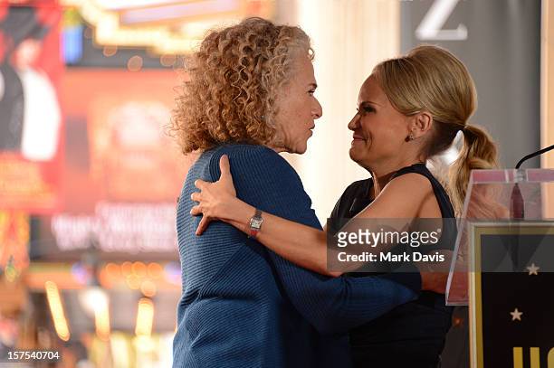 Carole King and Kristin Chenoweth share a moment onstage at the presentation of the 2,486th Star on the Hollywood Walk of Fame to Carole King on...