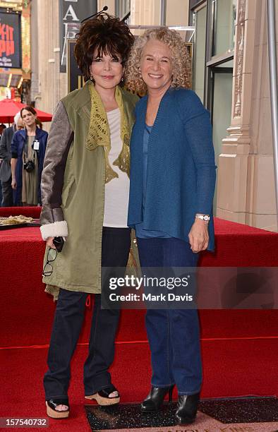 Singer/songwriters Carole Bayer and Carole King pose at the presentation of the 2,486th Star on the Hollywood Walk of Fame to Carole King on December...