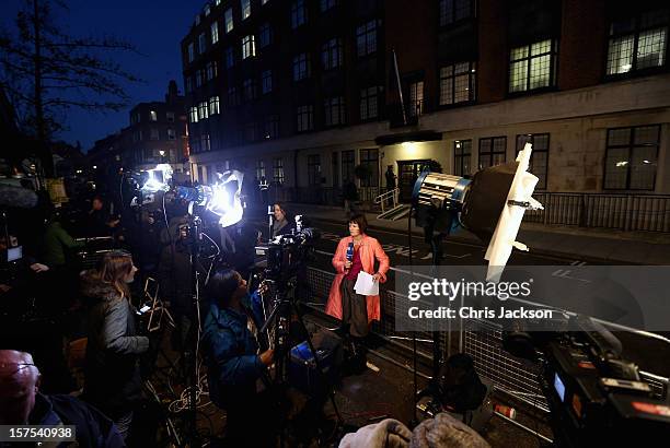 Members of the World's media gather as two Policemen stand guard in the early evening at the King Edward VII Private Hospital on December 4, 2012 in...