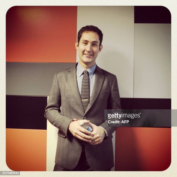 And co-founder of Instagram Kevin Systrom poses during the opening session of LeWeb12 on December 04, 2012 in Saint-Denis, near Paris. AFP PHOTO ERIC...