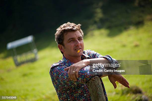 German actor Hans Sigl poses for a picture as he visits the filming location of German-Austrian tv serie 'Der Bergdoktor' on September 17, 2011 in...