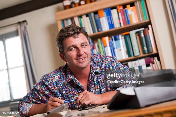 German actor Hans Sigl poses for a picture as he visits the filming location of German-Austrian tv serie 'Der Bergdoktor' on September 17, 2011 in...