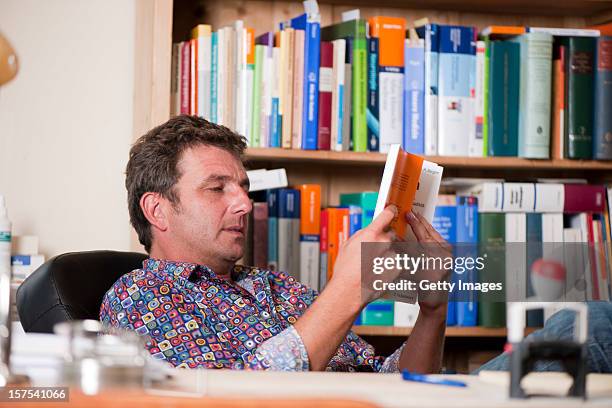 German actor Hans Sigl poses for a picture as he visits the filming location of German-Austrian tv serie 'Der Bergdoktor' on September 17, 2011 in...