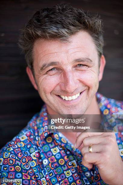 German actor Hans Sigl poses for a picture as he visits the filming location of German-Austrian tv serie 'Der Bergdoktor' on September 17, 2011 in...