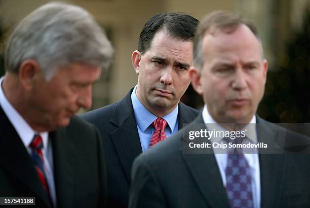 Governors Association Executive Committee members Arkansas Gov. Mike Beebe, Wisconsin Gov. Scott Walker and Delaware Gov. Jack Markell talk to...