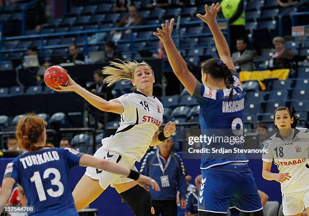 Helena Sterbova of Czech Republic shoots the ball near Olha Vashchuk of Ukraine during the Women's European Handball Championship 2012 Group A match...