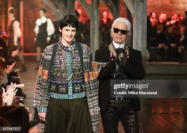Stella Tennant and Karl Lagerfeld walk the runway at the CHANEL: Metiers d'Art fashion show at Linlithgow Palace on December 4, 2012 in Linlithgow,...