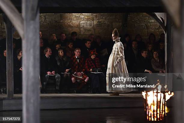 Model walks the runway at the CHANEL: Metiers d'Art fashion show at Linlithgow Palace on December 4, 2012 in Linlithgow, Scotland.