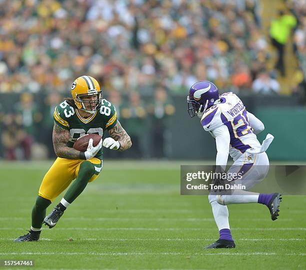 Tom Crabtree of the Green Bay Packers carries the ball during an NFL game against the Minnesota Vikings at Lambeau Field on December 2, 2012 in Green...