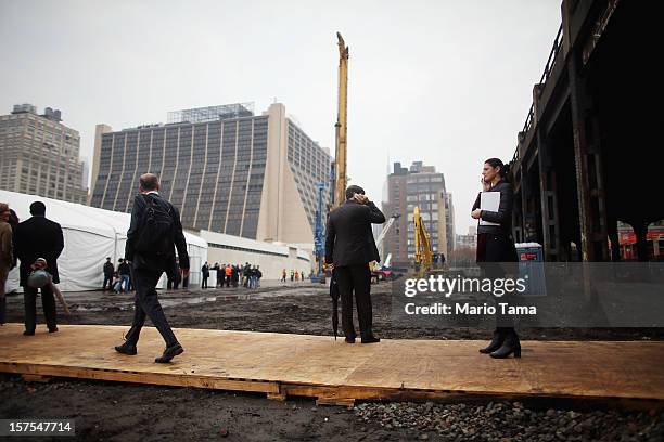 People gather to attend a groundbreaking ceremony for the Hudson Yards development which is expected to boast 13 million square feet of residential...