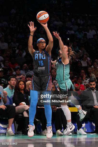 Allisha Gray of the Atlanta Dream shoots the ball against Sabrina Ionescu of the New York Liberty at the Barclays Center on July 27, 2023 in the...