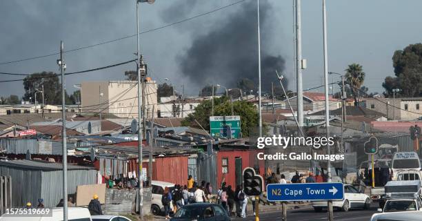 Bus burns in Nyanga on August 03, 2023 in Cape Town, South Africa. Commuters were left stranded after taxi operators went on strike Thursday...