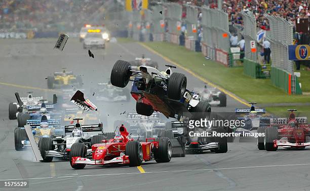 Ralf Schumacher of Germany and the BMW Williams Formula One Team Gets airborne after clipping the Ferrari of Rubens Barrichello at the 2002 Fosters...