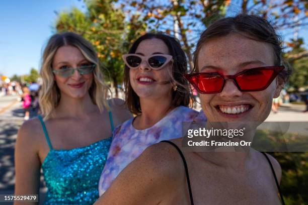 Inglewood, CA Taylor Swift fans Taylor Aldrich left, Brittney Armend Rachel Quarterman right, are all smiles as they arrive to SoFi Stadium on...