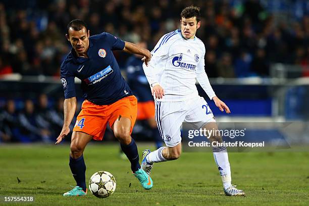 Tranquillo Barnetta of Schalke challenges Vitorino Hilton of Montpellier during the UEFA Champions League group B match between Montpellier Herault...