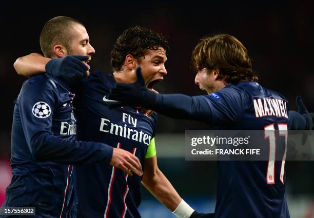 Paris Saint-Germain's Brazilian defender Thiago Silva celebrates with teammates French midfielder Jeremy Menez and Brazilian defender Maxwell after...