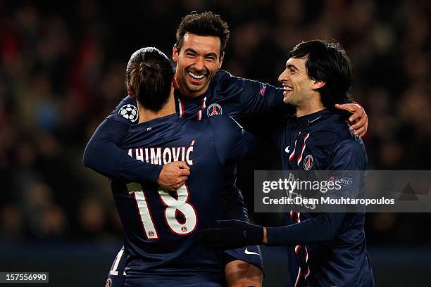 Ezequiel Lavezzi of PSG celebrates scoring his teams second goal of the game with team mates Zlatan Ibrahimovic and Javier Pastore during the Group A...