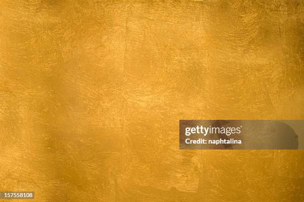 glitzernde gold textur - folie stock-fotos und bilder