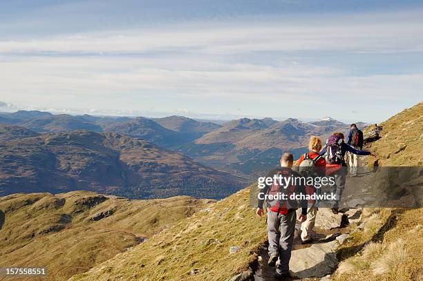 group of friends in the hills - hiking stock pictures, royalty-free photos & images