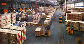 View from above inside a busy huge industrial warehouse