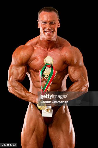 singer mit goldenen trophäe - bodybuilder isolated stock-fotos und bilder