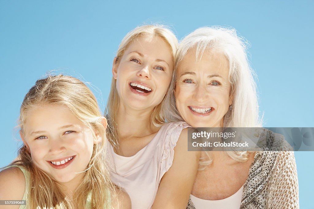 Senior woman smiling with daughter and granddaughter