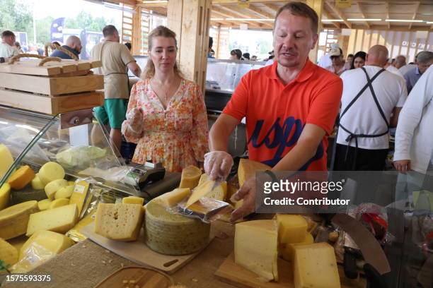 Seller presents his cheese at the "Cheese. Feast. World" festival on August 4, 2023 in Istra, 56 km west of Moscow, Russia. 350 cheese producers from...