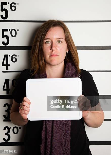 mugshot of a woman - police line up stock pictures, royalty-free photos & images
