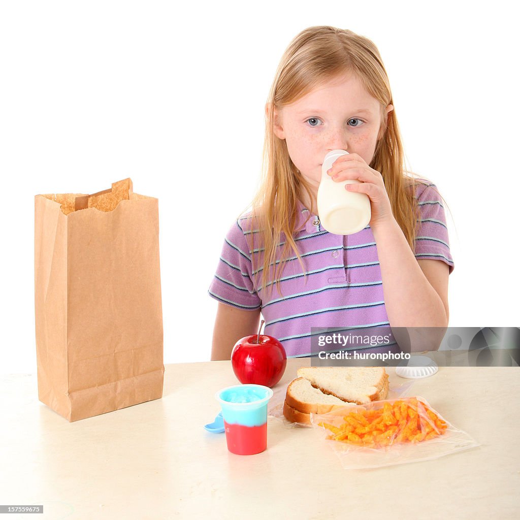 Girl drinking milk at lunch