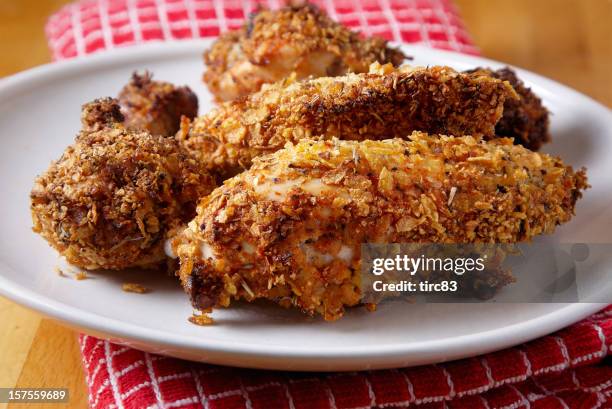 oven-fried chicken portions on a plate - creole culture stock pictures, royalty-free photos & images