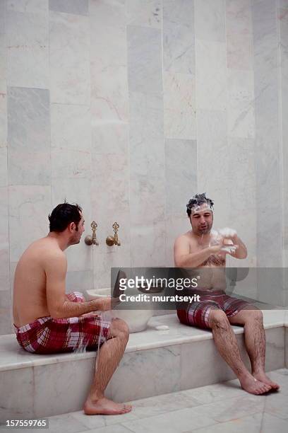 turkish hamam - men in loincloths stock pictures, royalty-free photos & images