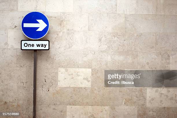 one way arrow sign with copy space - one direction stock pictures, royalty-free photos & images
